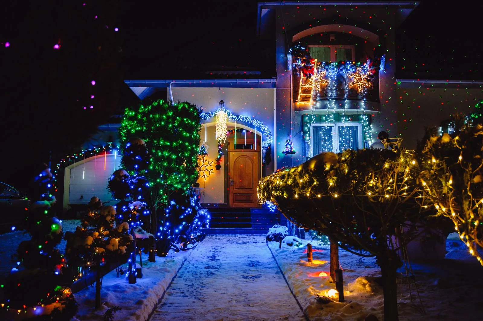 Home illuminated with colorful Christmas lights